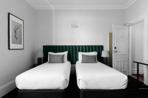 Voodi või voodid majutusasutuse Hotel Challis Potts Point toas