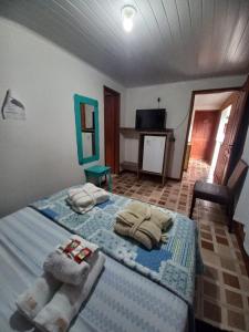Cama ou camas em um quarto em Pousada Klein