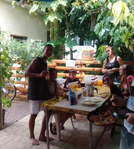 a group of people sitting around a table at Hostel Nossa Casa in Florianópolis