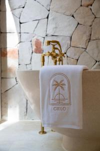 a towel on top of a sink in a bathroom at Cielo Boutique Hotel & Spa Samui in Bophut 