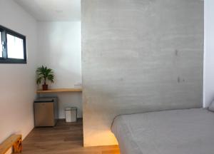 מיטה או מיטות בחדר ב-Summerflow Hostel