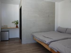 מיטה או מיטות בחדר ב-Summerflow Hostel
