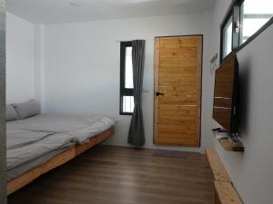מיטה או מיטות בחדר ב-Summerflow Hostel
