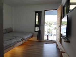 מיטה או מיטות בחדר ב-Summerflow Hostel