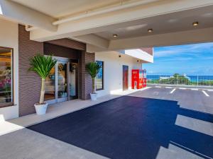 a house with a view of the ocean at Yukurina Resort Okinawa in Motobu