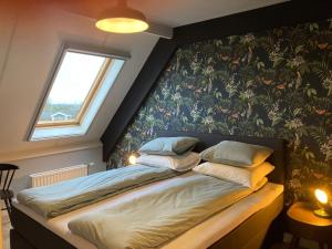 Postel nebo postele na pokoji v ubytování Hotel Workum