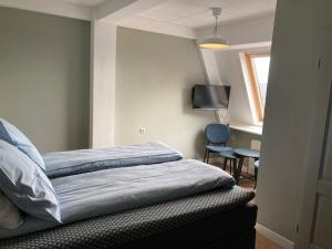 Postel nebo postele na pokoji v ubytování Hotel Workum