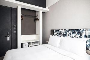 Ein Bett oder Betten in einem Zimmer der Unterkunft Page148, Page Hotels