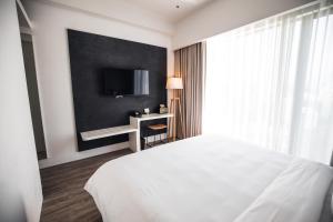 Ein Bett oder Betten in einem Zimmer der Unterkunft Page148, Page Hotels