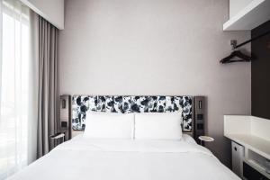 Ein Bett oder Betten in einem Zimmer der Unterkunft Page148, Page Hotels
