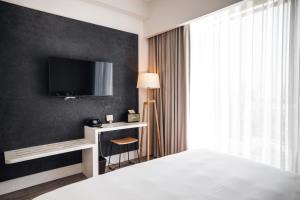 Ein Bett oder Betten in einem Zimmer der Unterkunft Page148, Page Hotels