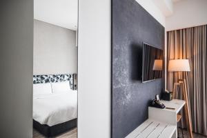 Ein Bett oder Betten in einem Zimmer der Unterkunft Page148, Page Hotels