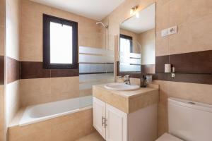a bathroom with a sink and a tub and a toilet at Penthouse La Cala De Mijas in La Cala de Mijas +19 photos