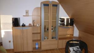 a large wooden cabinet in a living room at Ferienwohnung Irene in Ludwigschorgast