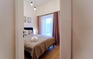 Posteľ alebo postele v izbe v ubytovaní LAGUNA Apartament Polanica Residence 54