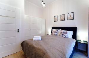 Posteľ alebo postele v izbe v ubytovaní LAGUNA Apartament Polanica Residence 54
