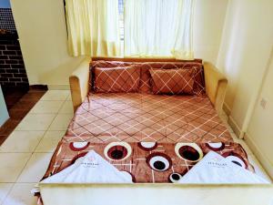 a bed in a room with a window at Ivy Cosy House, 2 BHK, Khandala in Khandāla