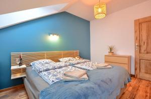 Łóżko lub łóżka w pokoju w obiekcie Apartamenty Maja i Zuzia