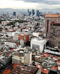 an aerial view of a city with tall buildings at Hotel Fleming in Mexico City