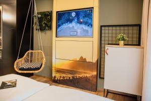 Una televisión o centro de entretenimiento en Rioca Stuttgart Posto 4
