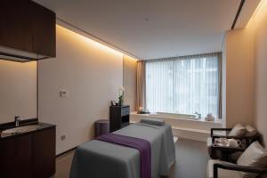 Voodi või voodid majutusasutuse The Five Residences Hanoi toas