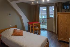 Postel nebo postele na pokoji v ubytování Hotel Piano 2 - Mont-St-Guibert - Louvain-la-Neuve