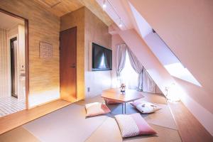 a living room with a table and a window at Asakusa Kaede 浅草楓 in Tokyo