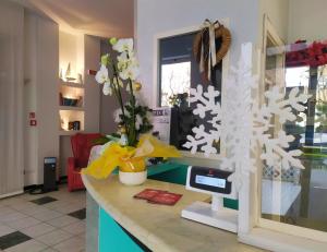 a room with a counter with a christmas tree on it at Hotel Caesar in Pesaro