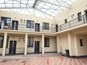 a large building with balconies and a glass ceiling at Apartament centrul vechi in Baia Mare
