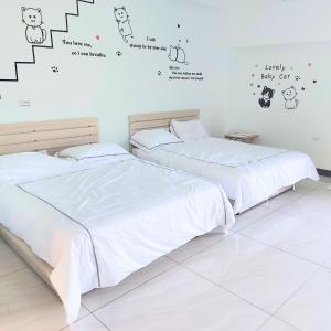 Postel nebo postele na pokoji v ubytování Xian Jing B&B