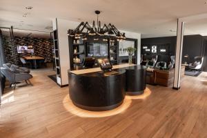 a large room with a bar in the middle at Gr8 Hotel Oosterhout in Oosterhout