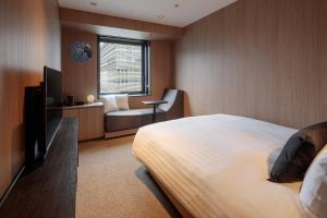 TV a/nebo společenská místnost v ubytování Yokohama Tokyu REI Hotel
