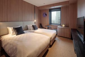 TV a/nebo společenská místnost v ubytování Yokohama Tokyu REI Hotel
