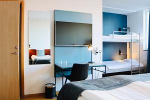 Cama o camas de una habitación en First Hotel Jörgen Kock