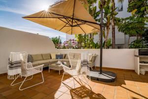 A patio or other outdoor area at GH-Modern 2 bed apartment with Pool in Estepona