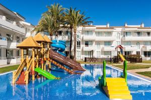 a swimming pool with a playground in a resort at Hoposa Hotel & Apartaments VillaConcha in Port de Pollensa