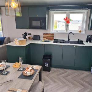 A kitchen or kitchenette at Mawgan Pads Padstow