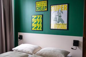 Ліжко або ліжка в номері SLEEEP HOTEL Ansfelden