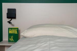 Ліжко або ліжка в номері SLEEEP HOTEL Ansfelden