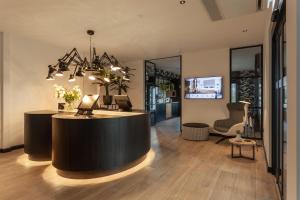 a lobby with a reception desk in a building at Gr8 Hotel Sevenum in Sevenum