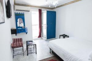 Un ou plusieurs lits dans un hébergement de l'établissement Hotel Moroccan House Casablanca
