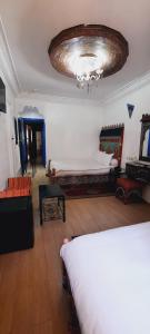 Un ou plusieurs lits dans un hébergement de l'établissement Hotel Moroccan House Casablanca