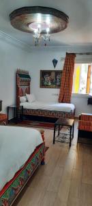 Un ou plusieurs lits dans un hébergement de l'établissement Hotel Moroccan House Casablanca