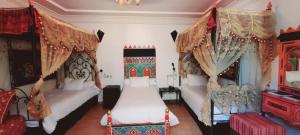 Un ou plusieurs lits dans un hébergement de l'établissement Hotel Moroccan House Casablanca
