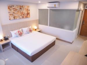 Postel nebo postele na pokoji v ubytování Malee Hotel