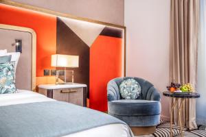 Postel nebo postele na pokoji v ubytování Hotel Bristol
