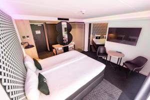 Postel nebo postele na pokoji v ubytování Gr8 Hotel Bodegraven