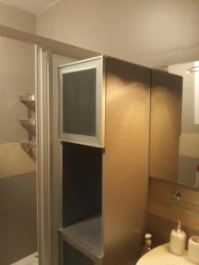 a bathroom with a shower with a toilet and a sink at Studio Detelina Residence in Bansko +35 photos