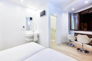 Postel nebo postele na pokoji v ubytování AMC Granada