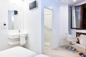 Postel nebo postele na pokoji v ubytování AMC Granada
